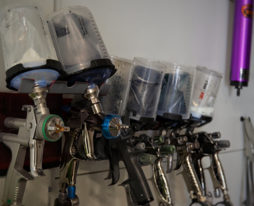 a image of spray guns mounted on the wall